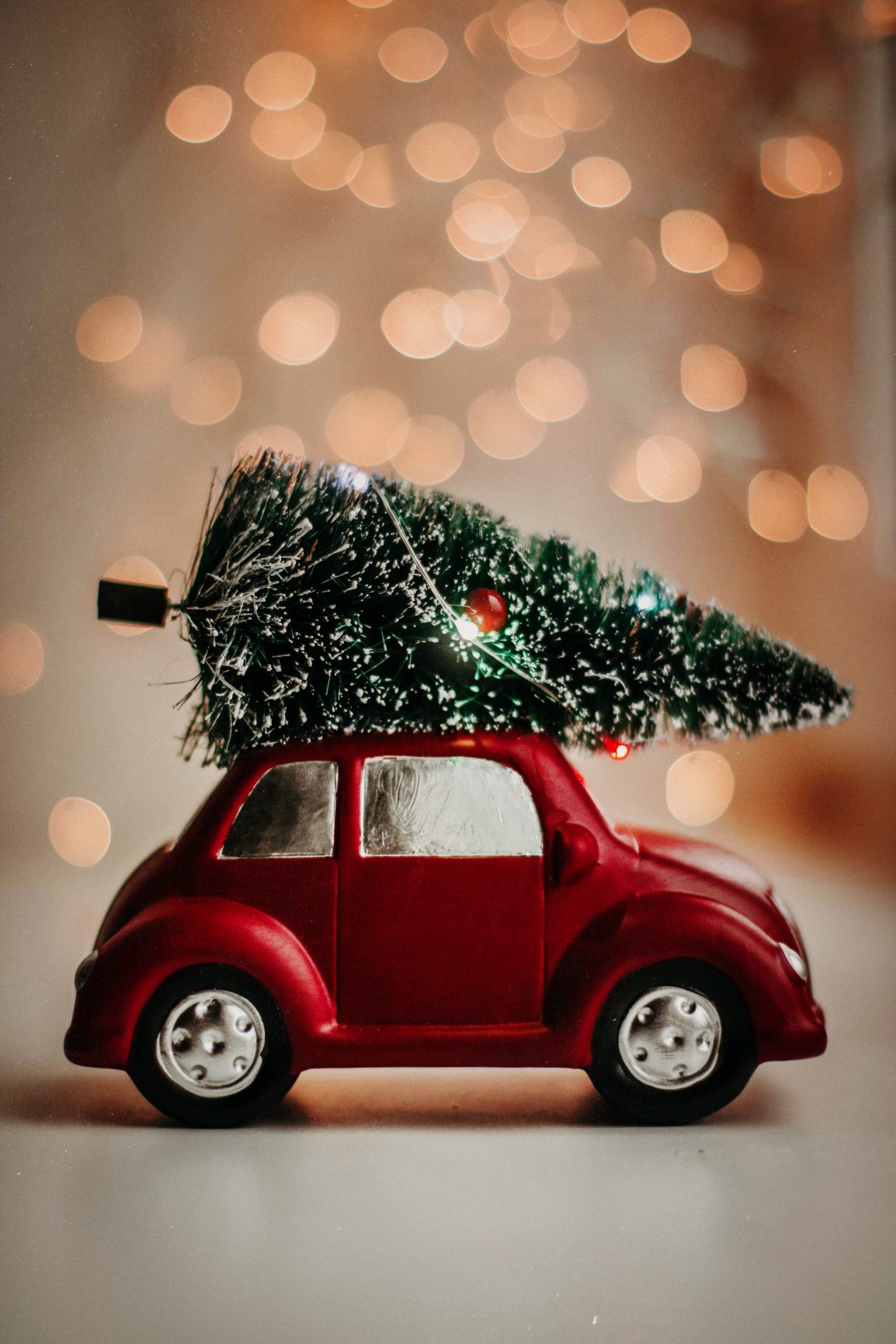 Car hauling a holiday tree