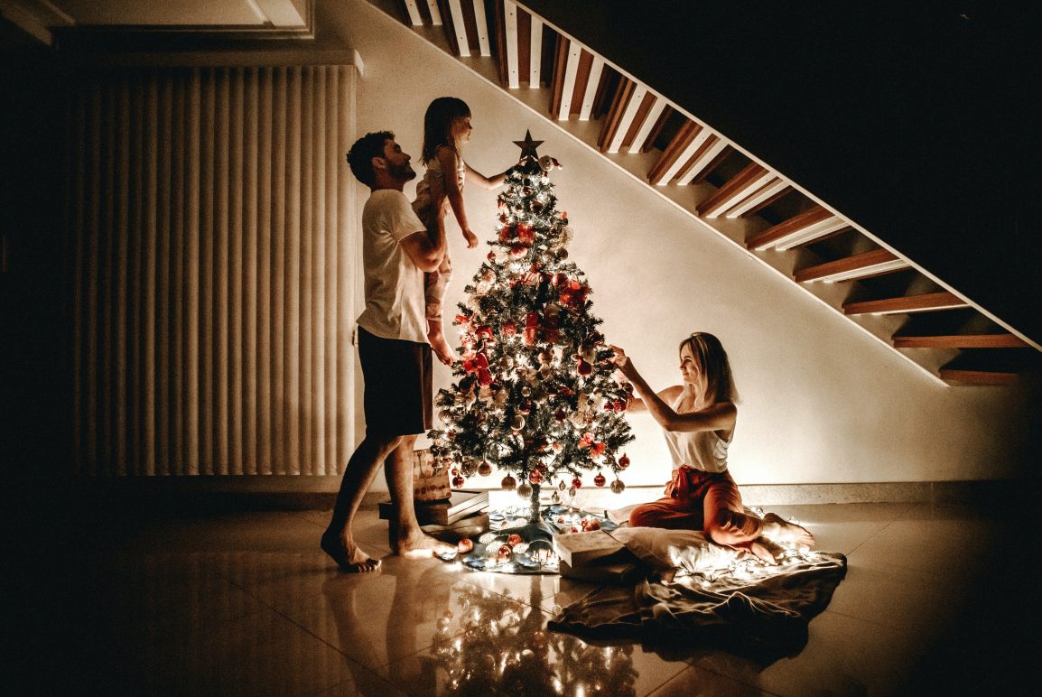 Family around Christmas tree