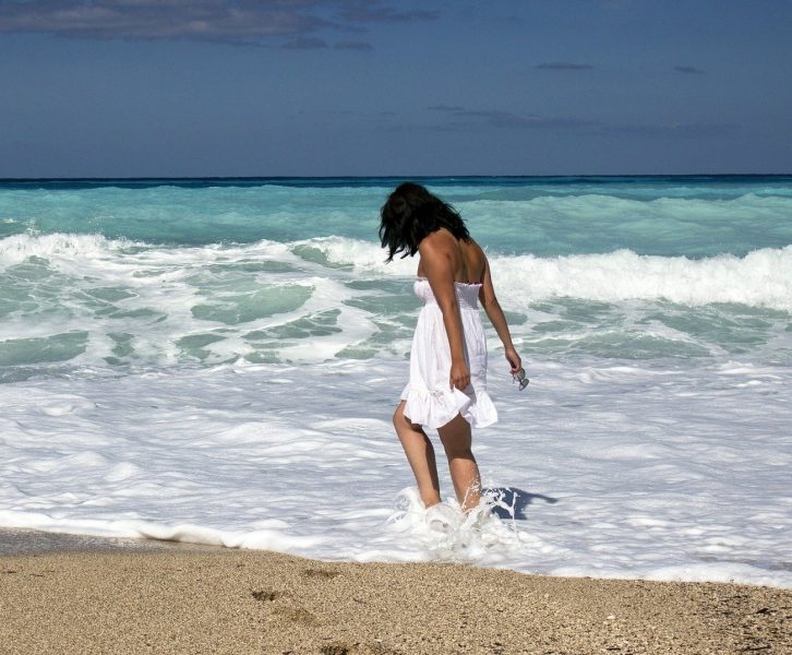 girl on beach, in the water.