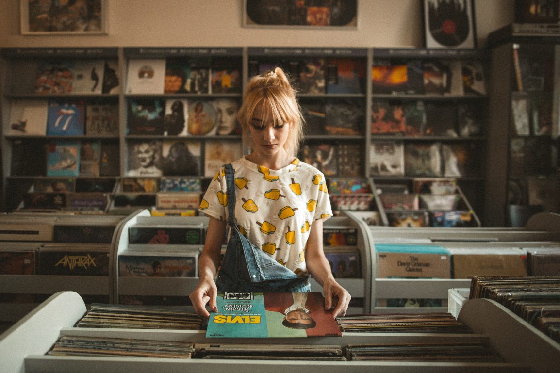 A girl flipping through records