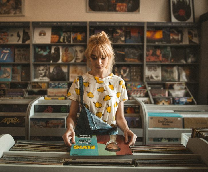 A girl flipping through records