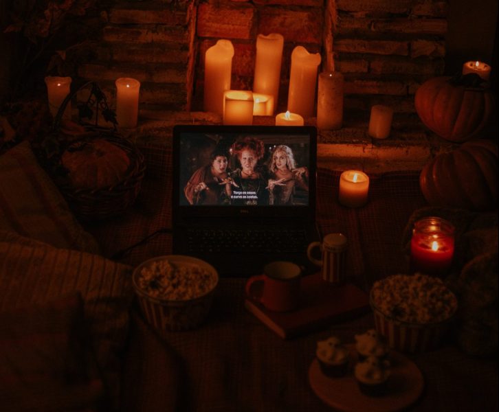 Hocus Pocus on a laptop surrounded by halloween decor