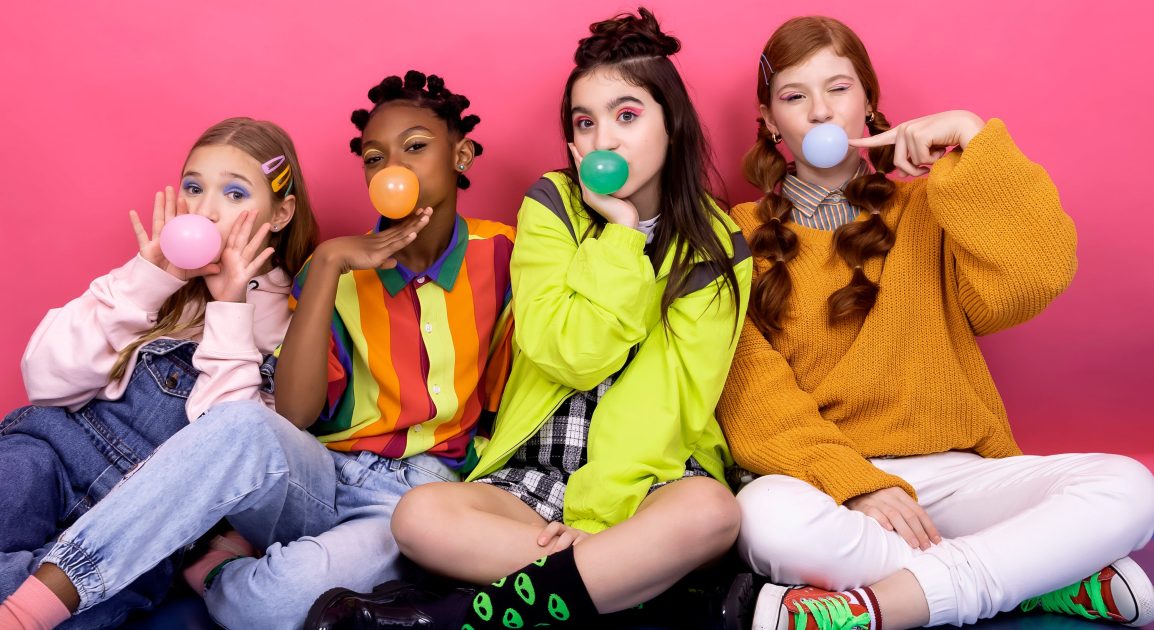 teen girls blowing bubblegum